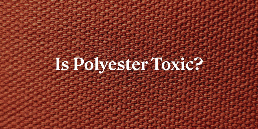 Is Polyester Toxic? Close-up of red dyed woven fabric.